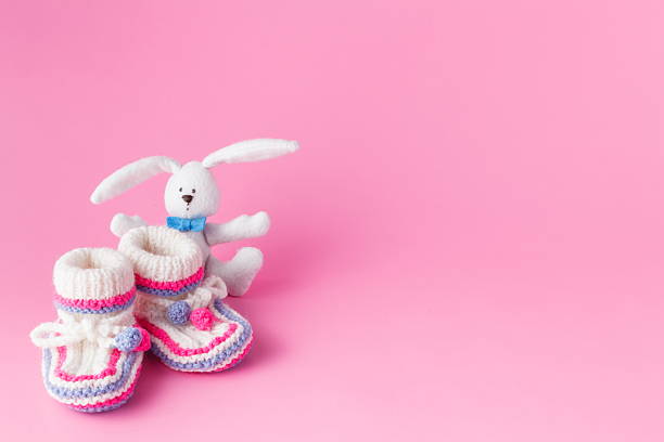 istock Newborn small toy with booties 505827876