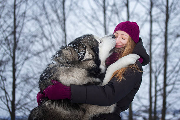 istock Girl hugging her dog 505828318