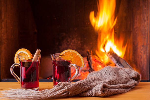 istock drinks and food at cozy fireplace 505828486