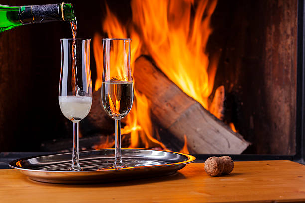 istock drinks and food at cozy fireplace 505828728