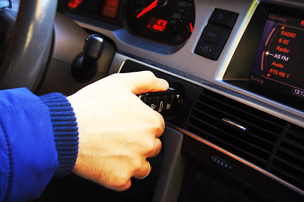 istock Man putting car key to the keyhole, starting the car 505829068