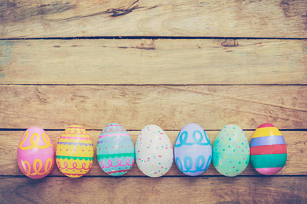 istock Easter eggs on wooden background with vintage tone. 505830132
