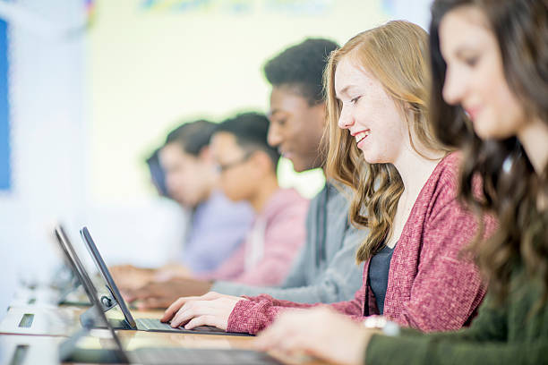 istock High School Students Checking Social Media 505830886