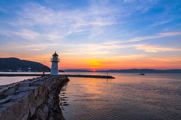istock Lighthouse at sunset by the Fjord 505838113