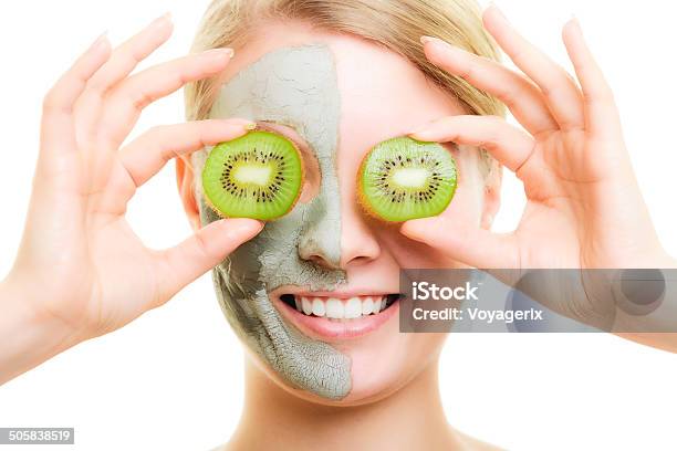 Skin Care Woman In Clay Mask With Kiwi On Face Stock Photo - Download Image Now - Acne, Adult, Algae