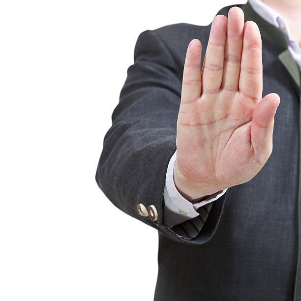 istock stop sign by one open palm - hand gesture 505839141