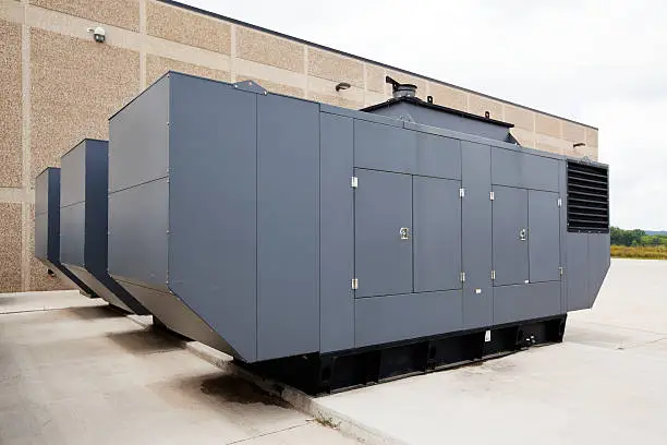 Three large industrial emergency power standby generators. This configuration could power a large facility such as a hospital, school even a small city.