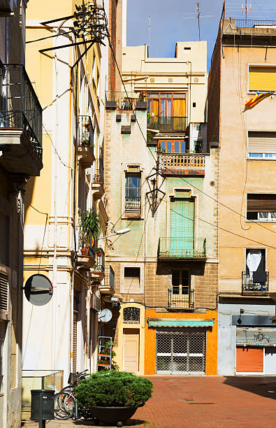 Old traditional houses on a street in Barcelona, Spain.