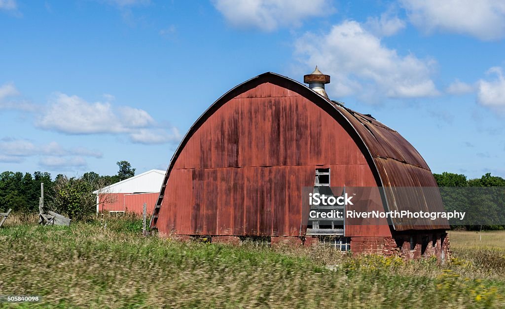 Red Barn in Northern Michigan An old red barn on the rural outskirts of Ludington, Michigan. Agriculture Stock Photo