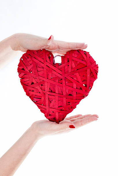 istock Woman Hands Hold Red Wicker Heart 505840162