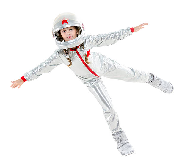 Zero gravity flight Cute little girl in the space suit floating in zero gravity. Isolated on white cosmonaut stock pictures, royalty-free photos & images