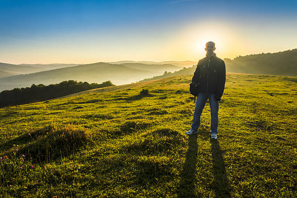 istock Man in mountains early  morning 505841469