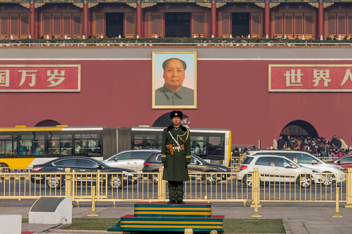 Tiananmen Gate Tower and Chinese soldiers standing guard in Beijing, China