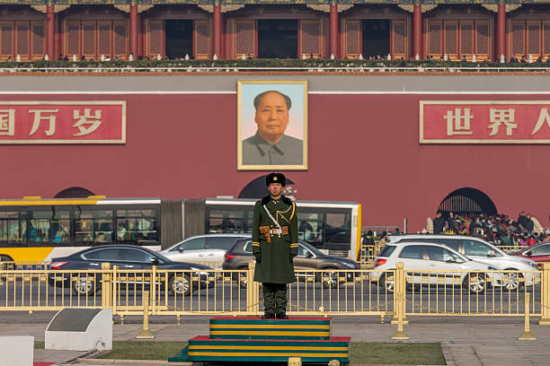 Tianamen Square and Forbidden City, Beijing Beijing, China - December 5, 2015: Tianamen Square is a famous tourist attraction in Beijing, China. A Chinese army guard standing in the front of the Tiananmen Square,which is the south entrance of the Forbidden City. forbidden city beijing architecture chinese ethnicity stock pictures, royalty-free photos & images