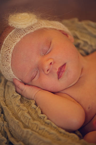 istock Beautiful Sleeping Newborn Baby in Basket 505842141