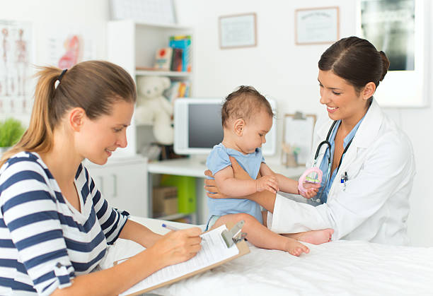 istock Cute baby boy at doctor's office. 505843073