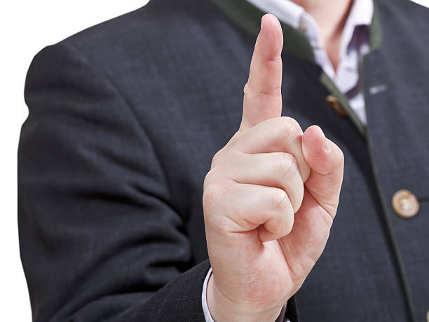 empresário apontando com o dedo indicador-gesto - number 1 businessman one finger one person imagens e fotografias de stock