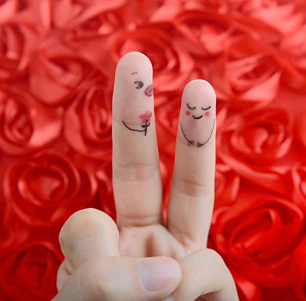 istock Painted finger smiley on red background, valentine concept. 505844065