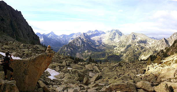 istock Climber taking a picture of a rock signal while climbing. 505844240