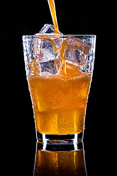 istock Pouring soft drink in a glass with ice 505844336