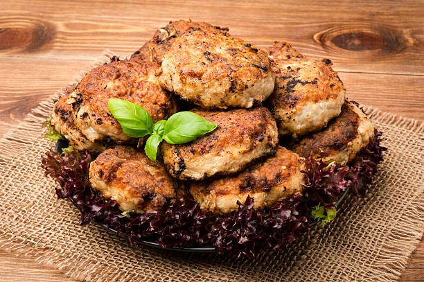 istock Roasted meat cutlets on the plate on the wooden surface. 505844678