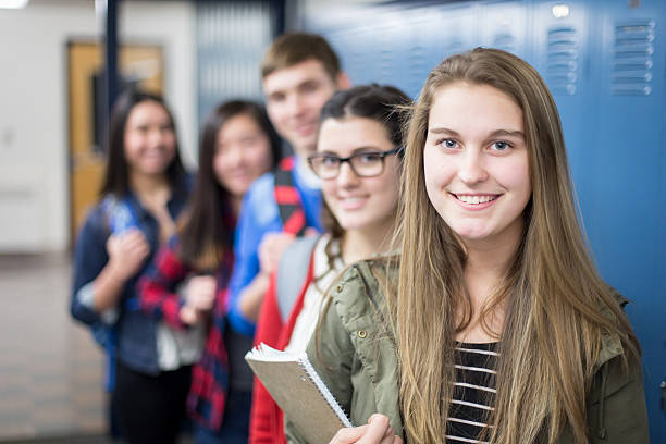 istock Group of high school students posing together 505845278