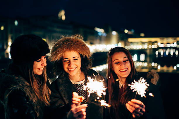 istock Three Happy Friends Celebrate Together With Sparklers 505845646