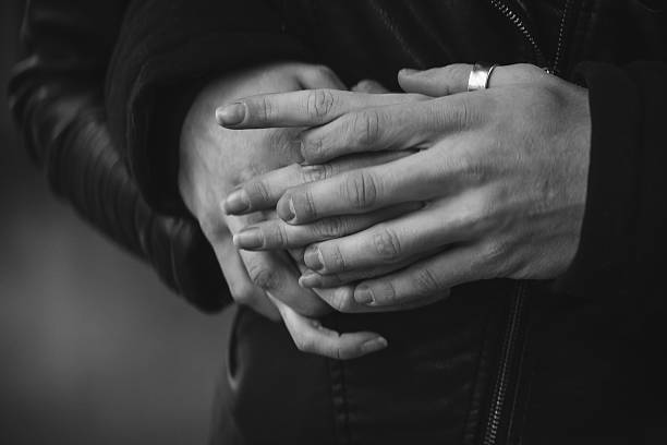 istock Close-up pair of holding hands lovers 505847610