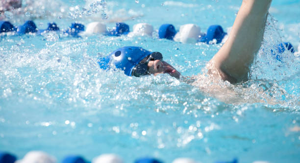 istock Young Teenage Boy Swimming Backstroke 505849858