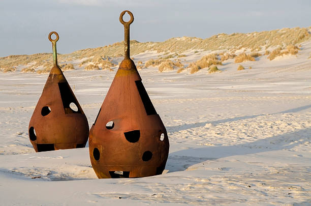 Old rusted shackles on the beach at Terschelling in the Netherlands.