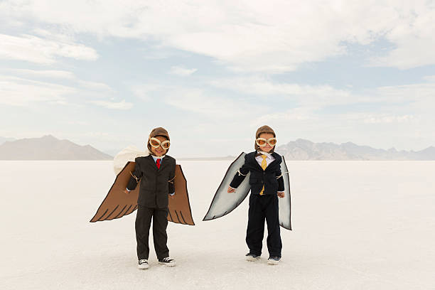 istock Young Business Boys Wearing Cardboard Wings 505851176
