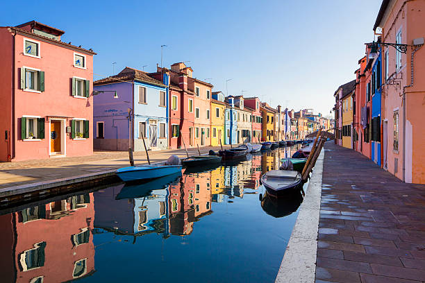 Venice Burano island canal, colorful houses and boats, Italy. murano stock pictures, royalty-free photos & images