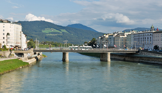 Cityscape with Salzach river and Staatsbrucke bridge in Salzburg, Austria