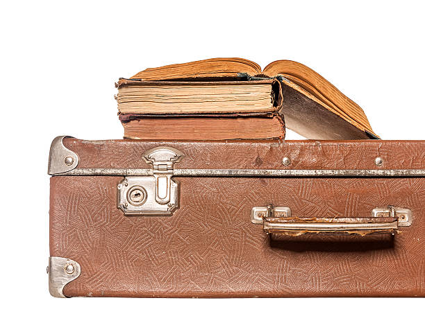 istock Old books on an old suitcase 505863306