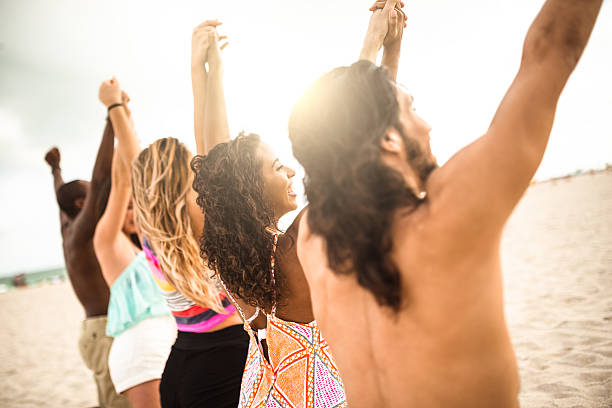 istock volunteer togetherness at dusk on the beach 505863416