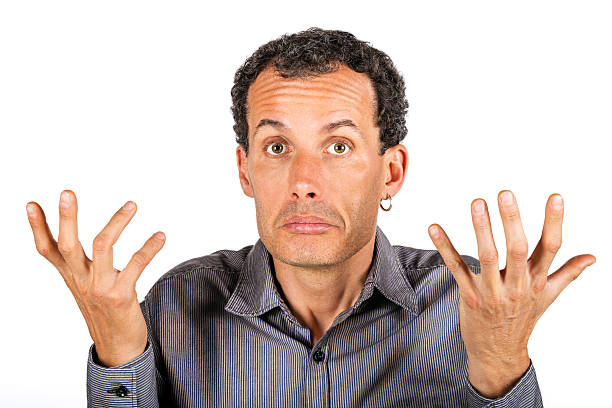 istock confused man giving I don't know gesture 505863598