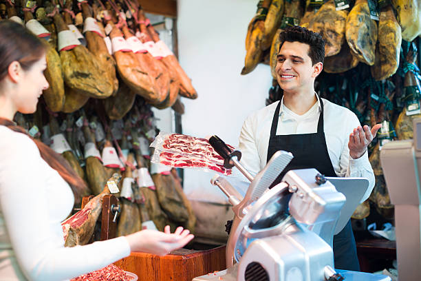 istock Female customer buying Spanish jamon 505866230