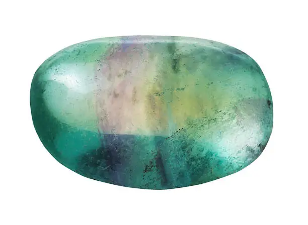 natural mineral gem stone - specimen of green Fluorite (fluorspar) gemstone isolated on white background close up