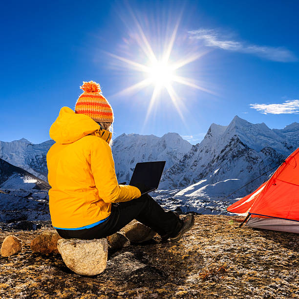 istock Young woman using laptop in Himalayas, Nepal 505867162