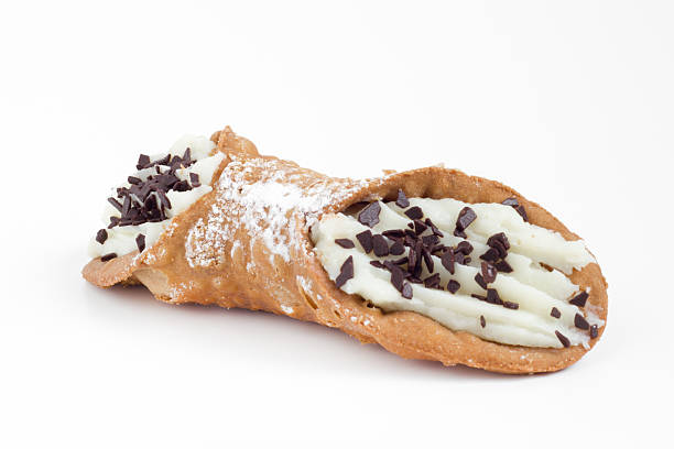 Sicilian cannolo Sweet homemade sicilian cannolo stuffed with ricotta cheese cream and chocolate flakes cannoli photos stock pictures, royalty-free photos & images