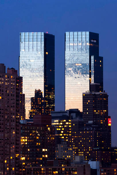 Time Warner Center in New York New York City, USA - March 25th, 2005 : The Time Warner Center twin tower office building with residential skyscrapers in Midtown Manhattan at night in New York City, USA. time warner center columbus circle pictures stock pictures, royalty-free photos & images