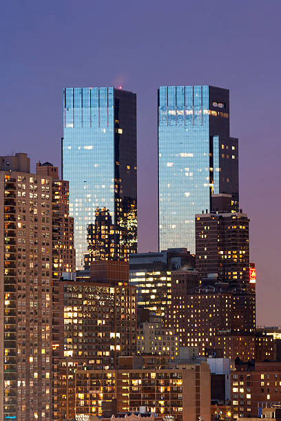 Time Warner Center New York City, USA - March 25th, 2005 : The Time Warner Center twin tower office building with residential skyscrapers in Midtown Manhattan at night in New York City, USA. time warner center columbus circle pictures stock pictures, royalty-free photos & images