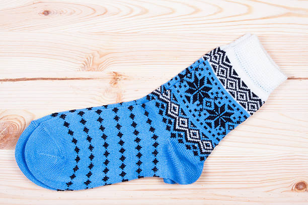 istock pair of socks on the wood 505869694