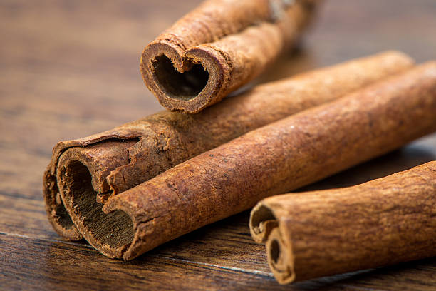 istock Essential cinnamon for spa, close up on wooden table 505869809