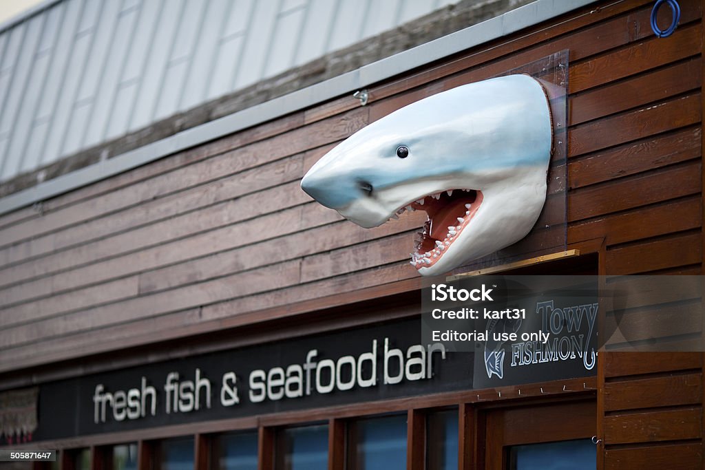 Plastic Shark head in Carmarthen Carmarthen, Carmarthenshire, Wales, UK, August 8 2014: Plastic shark head outside a fish shop in Carmarthen. Advertisement Stock Photo