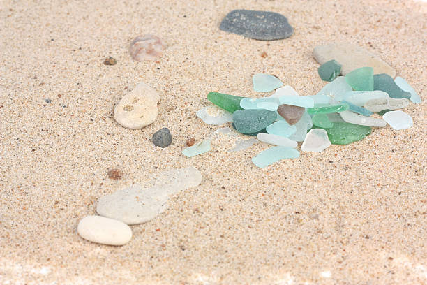 istock Sand texture with pieces of glass 505872575