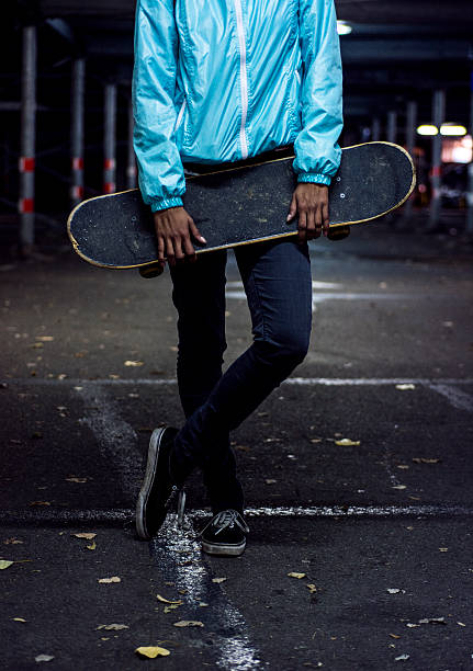 istock Young girl holding skateboard 505872860