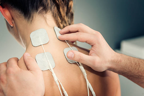 TENS treatment TENS treatment in physical therapy electrode stock pictures, royalty-free photos & images