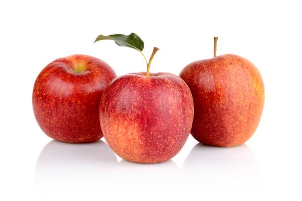 istock Studio shot of red apples with leaf 505873275