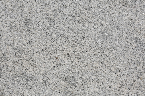 Seamless gray granite texture. Non polished gray granite as a background